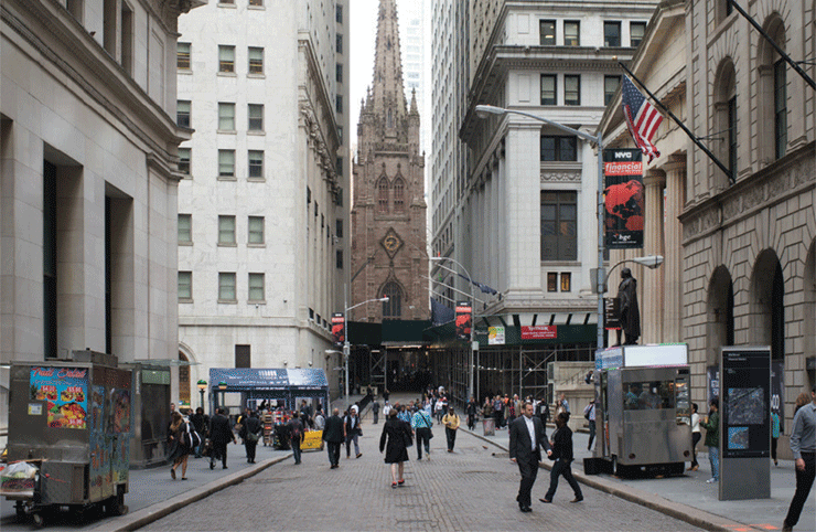 Wall Street, looking west, as it is today and a conceptual rendering of the streetscape with proposed features such as shared curbless streets, new paving and what the Downtown Alliance calls a "simplified security infrastructure." Images courtesy of the Downtown Alliance