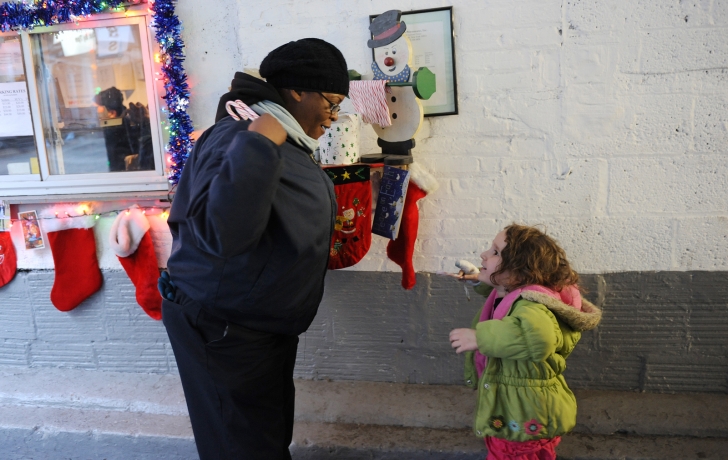 Sky Swerdloff, 3, is one of many neighborhood children who stop by the garage for treats and a big greeting from Amy. “Sky is a huge fan of Amy’s!” says Jill Swerdloff, her mother. Sky Swerdloff, 3, is one of many neighborhood children who stop by the garage for treats and a big greeting from Amy. “Sky is a huge fan of Amy’s!” says Jill Swerdloff, her mother.