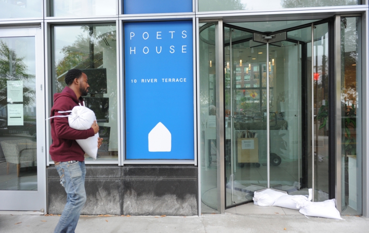 Claude McCalla, the Poets House facilities manager, places sandbags at the front door. Carl Glassman/Tribeca Trib Claude McCalla, the Poets House facilities manager, places sandbags at the front door. Carl Glassman/Tribeca Trib
