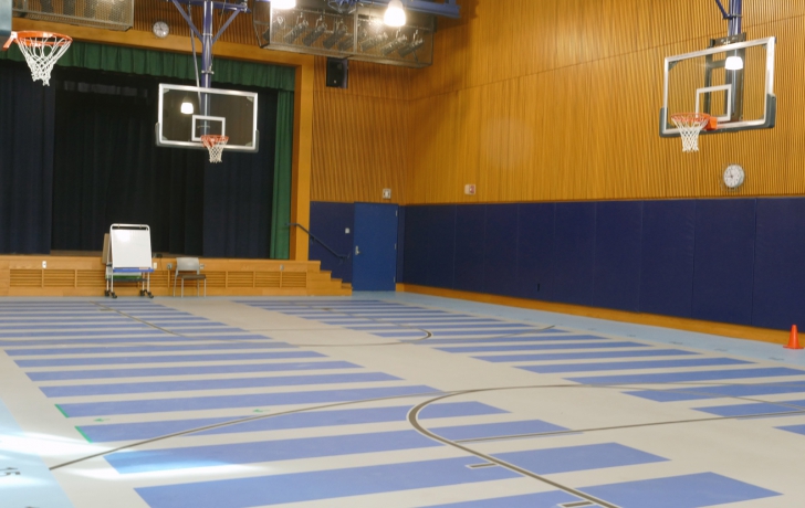 The "gymatorium" serves as both gym and, with seating, an auditorium (stage at left) for performances. Photo: Carl Glassman/Tribeca Trib The "gymatorium" serves as both gym and, with seating, an auditorium (stage at left) for performances. Photo: Carl Glassman/Tribeca Trib