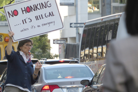 Erica Rooney gets the message out to Holland Tunnel-bound drivers that unnecessary honking is illegal. Photo: Carl Glassman/Tribeca Trib