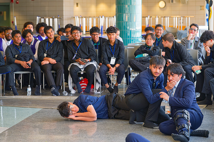 Teams are given a situation by the judges and they must quickly come up with a way to act it out. Photos: Carl Glassman/Tribeca Trib