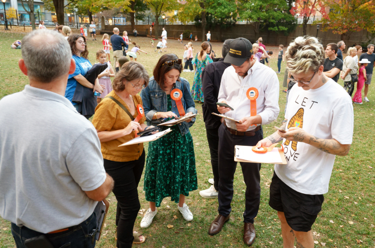 Judges confer over their choices for winners in six categories. From left: Karie Parker Davidson, president of Friends of Duane Park; Rachel Cantor of Dance With Miss Rachel dance studio; City Councilman Christopher Marte and artist Brandon Sines, who painted the park’s picnic tabletops. Other judges included Ralph Musolino of the Parks Department, (back to camera) and Nico Victorino, PS 150 principal (not shown). Photo: Carl Glassman/Tribeca Trib